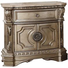 an antique style nightstand with carvings on the front and side panels, in silver finish