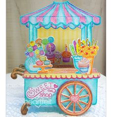 an image of a sweet shop cart with cupcakes and sweets on it's stand