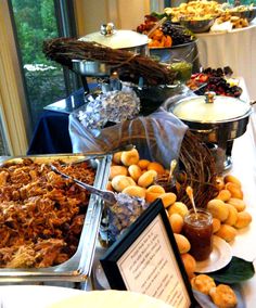 a buffet table filled with lots of food