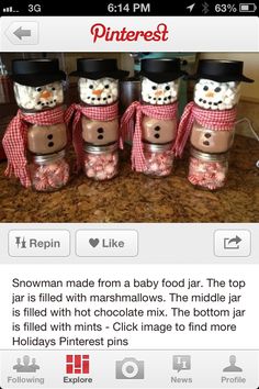 four snowman made from baby food jar the top jar is filled with marshmallows