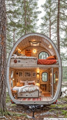 a bedroom in the shape of a treehouse with a bed and desk inside it