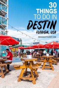 people sitting at picnic tables under red umbrellas with the words 30 things to do in destin florida usa