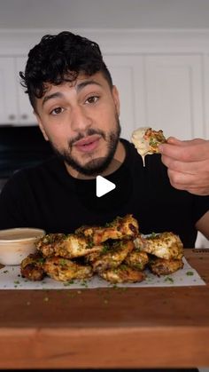 a man is eating some food on a plate