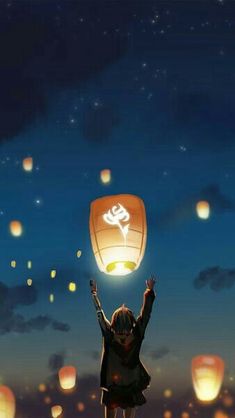 a woman holding up a lantern in the air at night with lanterns floating above her