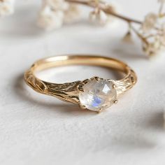 **Make a sparkling statement with this natural inspired Moonstone Engagement Ring at your next event. It's crafted in sterling silver, Gold/White Gold/Rose Gold bands. This ring is beautifully decorated with genuine Moonstones.  *Stone Keep in mind, every piece we create is one-of-a-kind, with raw stones that differ in size, shape, and color. When ordering, anticipate some variations. Want to see your specific stone? Just send me a message, and I'll happily provide photos for you to choose from. Moonstone Wedding Ring Vintage, Octopus Engagement Ring, Oval Moonstone Engagement Ring, Crystal Promise Ring, Vintage Moonstone Ring, Wedding Ring Moonstone, Moonstone Promise Ring, Moonstone Ring Engagement, Natural Engagement Ring