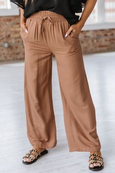 Feel comfortable and look stylish in our Heidi Drawstring Wide Leg Pant! Featuring a flattering wide-leg silhouette and an adjustable drawstring waistband, you'll stay comfortable while looking your best! Model Info: Models are 5'7", Size 2, wearing smalls Fabric: 100% polyester Sizes Hip Inseam Bottoms Trousers_Waist Outseam Relax Relax Relax Relax Relax S 39.8 27.9 24.9 26.4 40.2 M 41.7 28.0 26.0 28.3 40.6 L 43.7 28.0 27.1 30.3 40.9 XL 46.9 28.1 28.9 33.5 41.3 Elasticity None Razorback Shirt, Clear Stadium Bag, Stadium Bag, Plus Size Pants, Wide Leg Pant, Best Model, Casual Blazer, Look Stylish, Trendy Colors