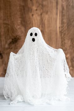 a white cloth ghost with black eyes