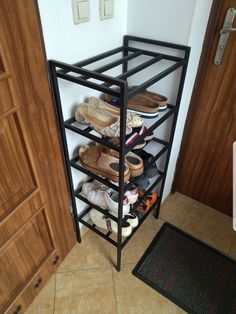 a shoe rack with several pairs of shoes on it