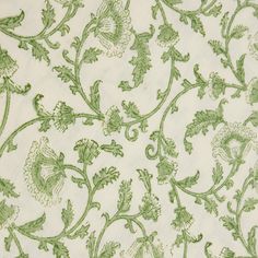 green and white fabric with floral designs on it