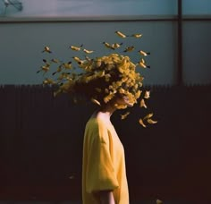 a woman with yellow flowers on her head