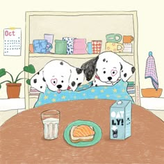 three puppies laying on top of a bed next to a box of milk and a drink