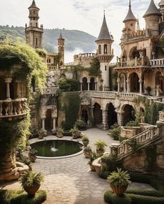 an old castle with lots of plants and trees in the front yard, surrounded by greenery