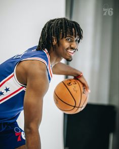 a man holding a basketball in his right hand