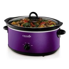 the crock pot is on display with its lid open and it's full of food