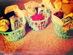 three baskets filled with items sitting on top of a table