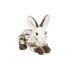 a stuffed animal rabbit sitting on top of a white surface