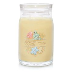 yankee candle christmas cookie scented jar candle in yellow with white lid and clear glass container