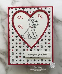 a card with a dog and hearts on it