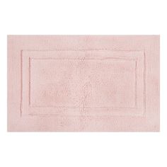 a pink bath rug on a white background