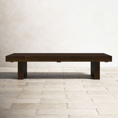 a wooden bench sitting on top of a white tiled floor