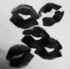 black and white photograph of lips floating in water