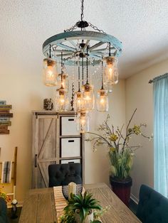 a chandelier hanging from the ceiling in a dining room