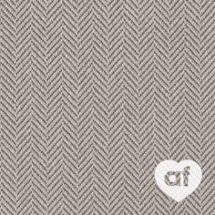 the back side of a gray and white herringle fabric with a heart on it