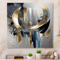 an abstract painting with gold and black colors on a white wall in a living room