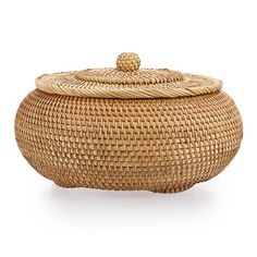 a woven basket with a lid and handle on the top, sitting on a white surface