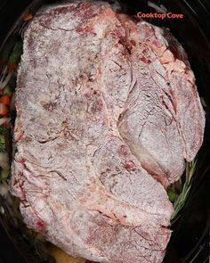 a large piece of meat in a slow cooker