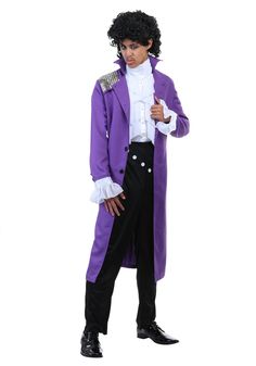 a man in a purple coat and black pants is standing with his hand on his hip