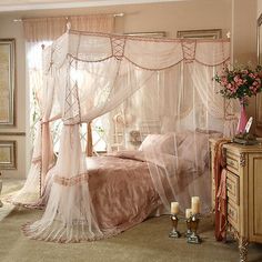 a bedroom with pink bedding and curtains