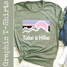 Take A Hike Round Neck T-Shirt Color: Green Size: X-Large Material: 65% Cotton And 35% Polyester Care: Hand Wash Cold Water (See Label Instructions) Length: Approximately 28” Pit To Pit: Approximately 21.5” Ii0614 Spring Outdoor T-shirt With Letter Print, Outdoor Green T-shirt With Graphic Print, Green Graphic Print Outdoor T-shirt, Green Graphic Print T-shirt For Outdoor, Casual Slogan T-shirt For Outdoor, Spring Graphic Print Tops For Outdoor, Green Letter Print T-shirt For Outdoor Activities, Green T-shirt With Letter Print For Outdoor Activities, Green Graphic Tee For Outdoor Activities