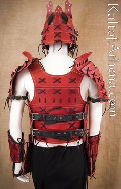 a male mannequin dressed in red and black armor with spikes on his back