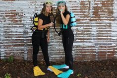 two women dressed in scuba gear standing next to each other