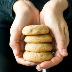 a person holding some cookies in their hands