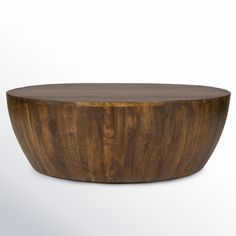 a round wooden table on a white background