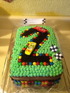 a birthday cake that is shaped like a race car