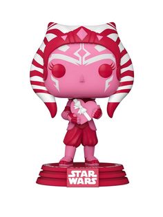 the pink star wars pop vinyl figure is standing on top of a red base with white stripes