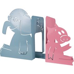 an elephant and pig shaped bookends sitting next to each other on a white background