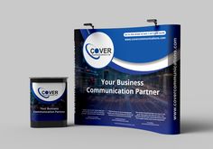 a large roll up banner next to a canister with the company's logo on it