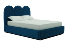 a bed with blue headboard and white sheets on it's sides, in front of a white background