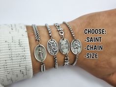 "Catholic saint chain bracelets, handmade in Medjugorje, by a member of our family. Choose your chain style and size of bracelet in dropdown menus. Type saint charm in the personalization tab (Photos 3, 4, 5) Every bracelet is adjustable to fit several wrist sizes. (Photo 6) Message card of Holy Lady from Medjugorje included. Also a free Medjugorje powers card with every multi item order. NOTE: We also have Custom Gift Cards, all You need to do after purchase is to send us message via \"note to Catholic Jewelry Bracelets, Saint Bracelet, Saint Medals, Chain Bracelet Silver, Catholic Company, Custom Gift Cards, Catholic Saint, Handmade Jewelry Shop, Mens Bracelet Silver