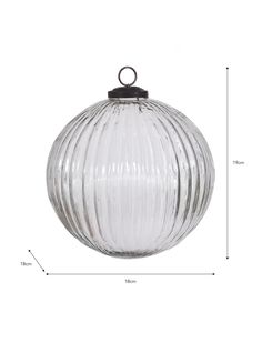 a glass ornament hanging from the ceiling with measurements for each item in front of it