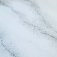 an airplane is flying through the air covered in snow and ice as seen from above