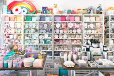 a room filled with lots of different types of crafting supplies and crafts on shelves