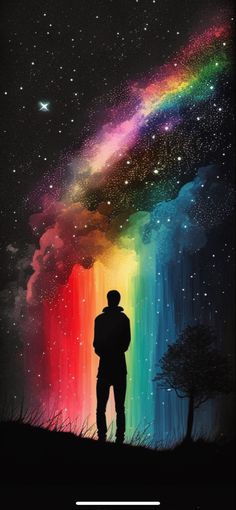 a man standing in front of a rainbow colored sky