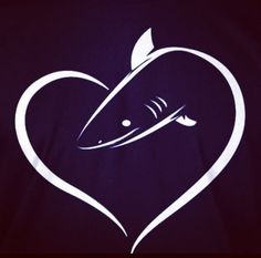 a heart shaped t - shirt with a shark on it's chest and an arrow in the shape of a heart