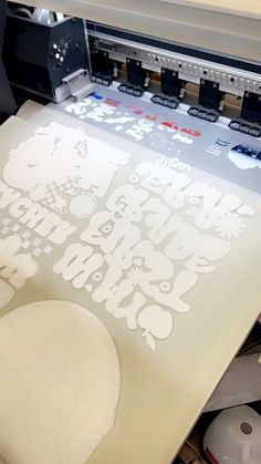 an image of a printer that is cutting out some designs on it's paper