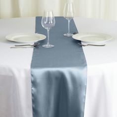 the table is set with two wine glasses